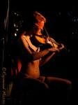 Two incredibly talented performers: juggler and balancing babe Miss Ellaneous with blindfolded violinist and poledancing beauty Danny De Mure. Photograph by Raymond Massa.